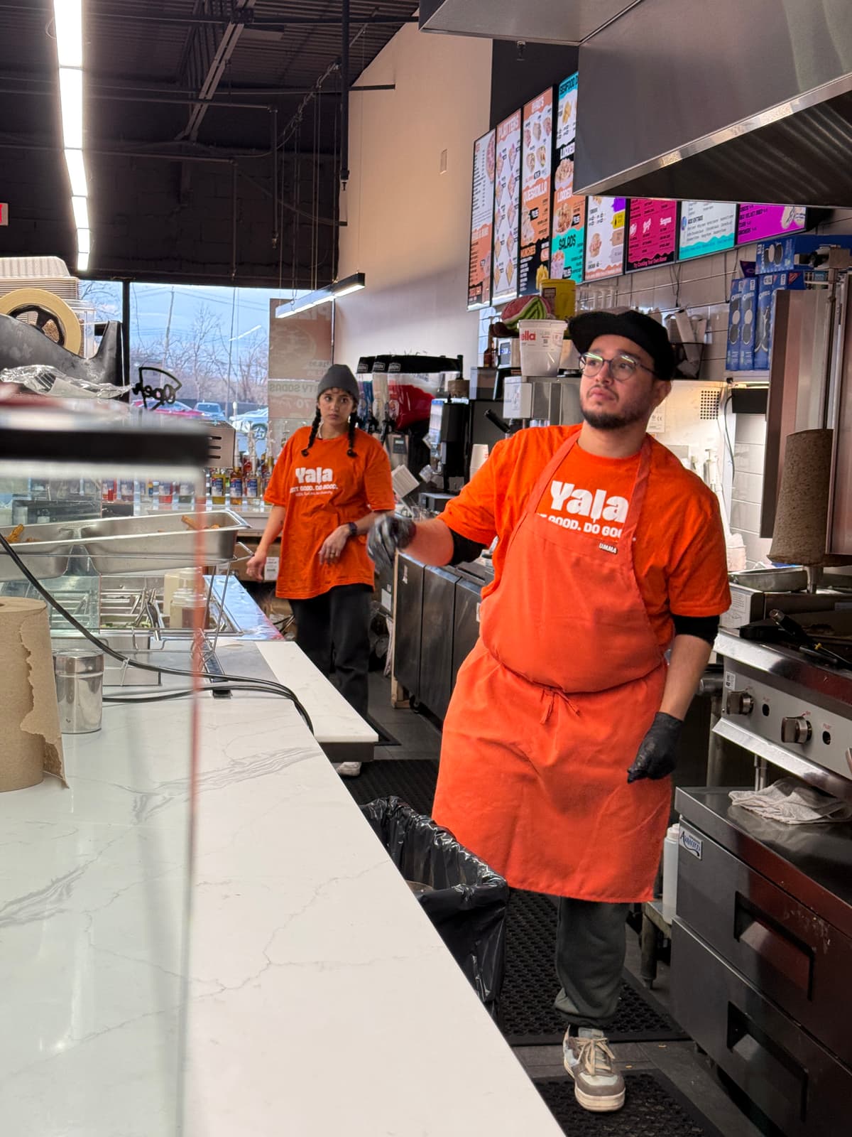 Crew wearing orange aprons