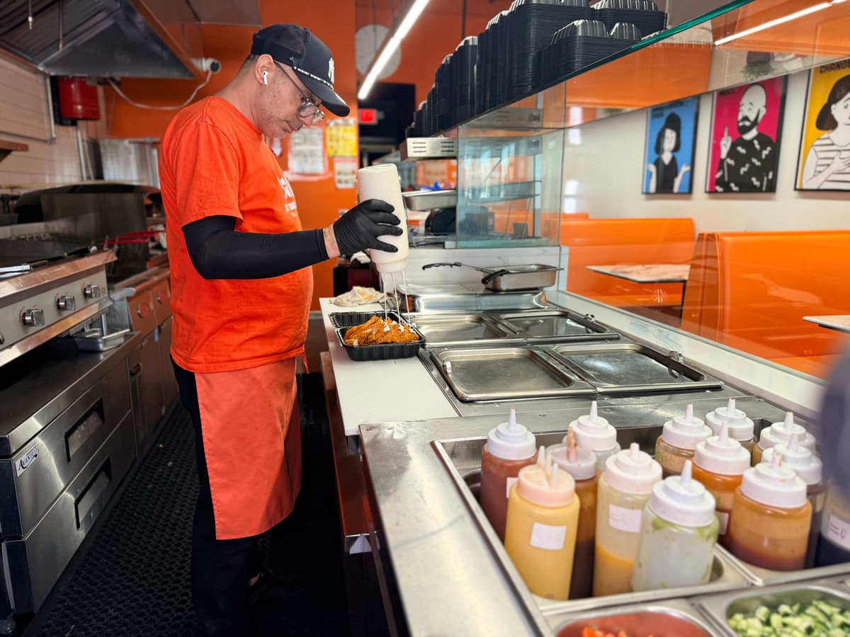 Orange apron in action